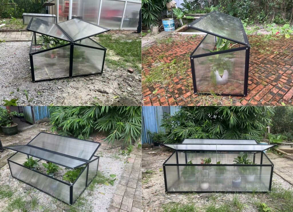 Real photo of a black aluminum alloy mini greenhouse placed on a balcony, showing its compact frame and clear panels